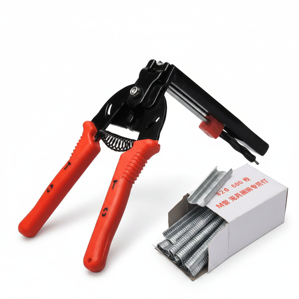 Pliers with red handles and a box of staples on a white background