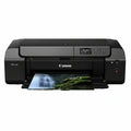 Canon printer with a photo of a waterfall and greenery on the paper output tray.