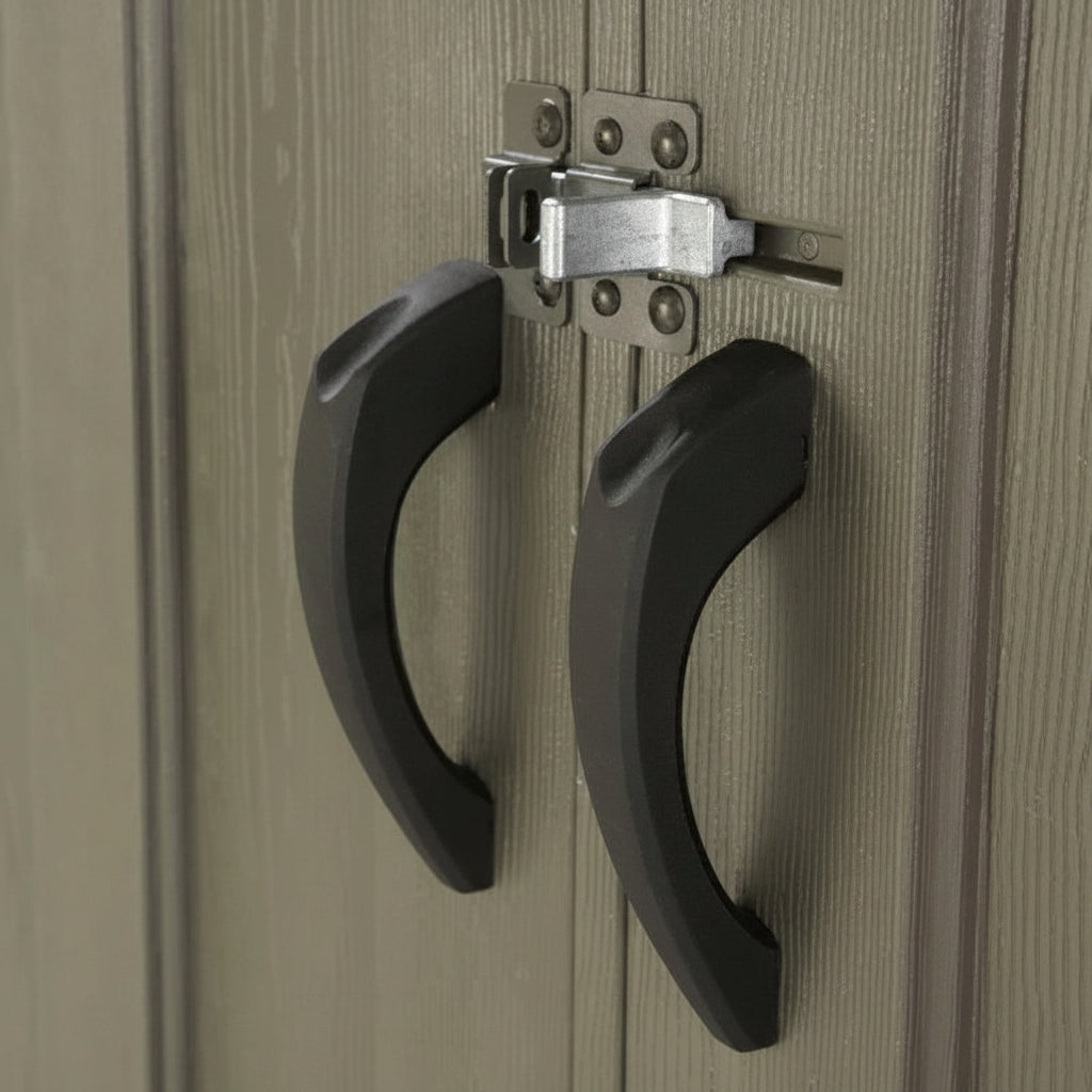 Close-up of black handles on a wooden door with a latch mechanism.